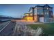 Expansive backyard featuring a large deck and patio area, perfect for outdoor entertaining and relaxation at 8727 Hunters Hill Ln, Littleton, CO 80125
