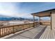 Enjoy sweeping mountain and river views from the home's private outdoor balcony at 8727 Hunters Hill Ln, Littleton, CO 80125