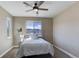 Cozy bedroom features mountain views, a ceiling fan, and neutral decor for a relaxing atmosphere at 8727 Hunters Hill Ln, Littleton, CO 80125