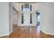 Elegant foyer features hardwood floors, soaring ceilings, large windows, and lots of natural light at 8727 Hunters Hill Ln, Littleton, CO 80125