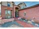 Charming brick home exterior featuring a walkway leading to the front door, with a bay window at 8727 Hunters Hill Ln, Littleton, CO 80125