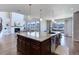 Gourmet kitchen featuring a large center island with pendant lighting and mountain views at 8727 Hunters Hill Ln, Littleton, CO 80125