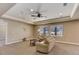 Comfortable living room with plush seating, ceiling fan, and scenic mountain views through large windows at 8727 Hunters Hill Ln, Littleton, CO 80125