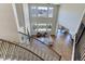 Grand living room with soaring ceilings, fireplace, and windows that showcase mountain views at 8727 Hunters Hill Ln, Littleton, CO 80125
