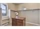 Walk-in closet with storage shelving and a center island with drawers for accessories at 8727 Hunters Hill Ln, Littleton, CO 80125