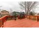Backyard deck with decorative plants and views of neighboring homes and trees at 10652 Hyacinth St, Highlands Ranch, CO 80129