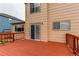 Wood deck attached to a home, with a sliding glass door entrance at 10652 Hyacinth St, Highlands Ranch, CO 80129