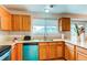 Kitchen featuring bright countertops, updated appliances, and wood cabinets at 10652 Hyacinth St, Highlands Ranch, CO 80129
