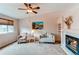 Spacious living room with neutral tones, fireplace, and ample natural light at 10652 Hyacinth St, Highlands Ranch, CO 80129