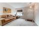 Inviting living room with ample natural light and a comfortable seating arrangement at 10652 Hyacinth St, Highlands Ranch, CO 80129