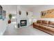 Cozy living room featuring a fireplace, neutral carpet, and comfortable seating at 10652 Hyacinth St, Highlands Ranch, CO 80129