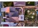 Overhead view of landscaped yard and patio with dining table, fire pit, and fence at 405 Buckskin Rd, Berthoud, CO 80513