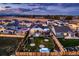 A beautifully landscaped backyard with a large, well-maintained lawn, trees, and decorative rock at 405 Buckskin Rd, Berthoud, CO 80513