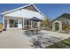 Backyard patio featuring outdoor seating, barbecue, and a well-maintained lawn at 405 Buckskin Rd, Berthoud, CO 80513