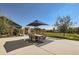 Large backyard featuring patio seating, a manicured lawn, and beautiful landscaping at 405 Buckskin Rd, Berthoud, CO 80513