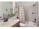 Well-lit bathroom featuring a tub, shower, and attractive decor at 405 Buckskin Rd, Berthoud, CO 80513