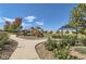 Community playground and grassy area with walking path and shaded structure in a residential neighborhood at 405 Buckskin Rd, Berthoud, CO 80513