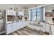 Bright craft room with custom cabinets, a window seat, and ample storage for creative projects at 405 Buckskin Rd, Berthoud, CO 80513