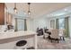 Cozy dining area featuring modern lighting, a stylish table, and comfortable seating at 405 Buckskin Rd, Berthoud, CO 80513