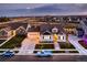 Craftsman style home with three-car garage, well-manicured lawn, and lovely landscaping at 405 Buckskin Rd, Berthoud, CO 80513