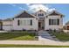 Charming home featuring stone accents, a well-maintained lawn, and freshly-trimmed landscaping at 405 Buckskin Rd, Berthoud, CO 80513