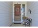Cozy front porch featuring rustic decor, a wooden bench, and an inviting atmosphere at 405 Buckskin Rd, Berthoud, CO 80513