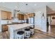 Bright kitchen features a large island with stool seating, modern appliances, and lots of cabinets for storage at 405 Buckskin Rd, Berthoud, CO 80513
