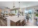 Open concept living space with views of the kitchen, dining and living areas, perfect for entertaining at 405 Buckskin Rd, Berthoud, CO 80513
