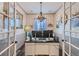 Inviting home office with French doors, stylish chandelier and plenty of desk space for working remotely at 405 Buckskin Rd, Berthoud, CO 80513