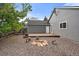 Backyard includes deck with room for seating around fire pit at 904 Clover Cir, Lafayette, CO 80026