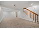 Finished basement with carpet flooring and stairs at 904 Clover Cir, Lafayette, CO 80026