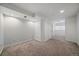 View of the finished basement with neutral carpet, recessed lighting and closet at 904 Clover Cir, Lafayette, CO 80026