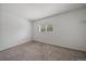 Neutral bedroom with carpet, window, and closet space at 904 Clover Cir, Lafayette, CO 80026