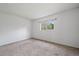 Neutral bedroom with carpet and a window letting in natural light at 904 Clover Cir, Lafayette, CO 80026