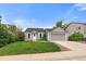Single-Gathering home with a well-manicured lawn and an attached two-car garage in a lovely neighborhood at 904 Clover Cir, Lafayette, CO 80026
