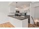 Modern kitchen features stainless steel appliances, gray countertop, and white cabinets at 904 Clover Cir, Lafayette, CO 80026