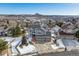 Aerial view of a house nestled in a neighborhood with mountain views at 1820 Cooper Ct, Castle Rock, CO 80109