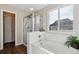 Clean bathroom with shower, tub and linen closet at 1820 Cooper Ct, Castle Rock, CO 80109