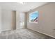 Simple bedroom with carpet, window, and a closet at 1820 Cooper Ct, Castle Rock, CO 80109