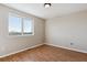 Bright bedroom with hardwood floors and a large window offering an open view at 1820 Cooper Ct, Castle Rock, CO 80109