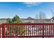 Deck overlooks scenic landscape and distant mountain views at 1820 Cooper Ct, Castle Rock, CO 80109