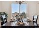 Dining room with mountain views, hardwood floors and a table set for four at 1820 Cooper Ct, Castle Rock, CO 80109