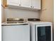 Laundry room with white cabinets and Samsung washer and dryer at 1820 Cooper Ct, Castle Rock, CO 80109