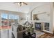 Spacious living room with a fireplace and sliding glass doors leading to a deck at 1820 Cooper Ct, Castle Rock, CO 80109