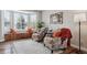 Cozy living room featuring bay window, hardwood floors, and comfortable seating at 1820 Cooper Ct, Castle Rock, CO 80109