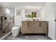 Modern bathroom features marble shower, stylish herringbone vanity, and modern toilet at 1024 W 8Th Ave, Denver, CO 80204