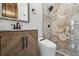 Modern bathroom features marble shower, stylish vanity, and sleek fixtures at 1024 W 8Th Ave, Denver, CO 80204