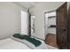 Bright bedroom features an ensuite bathroom with marbled shower and walk in closet at 1024 W 8Th Ave, Denver, CO 80204
