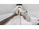 Spacious bedroom with wood floors, stylish furniture, pitched ceilings, and a skylight at 1024 W 8Th Ave, Denver, CO 80204