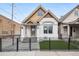 Charming home with brick accents, updated front door, and low-maintenance lawn at 1024 W 8Th Ave, Denver, CO 80204